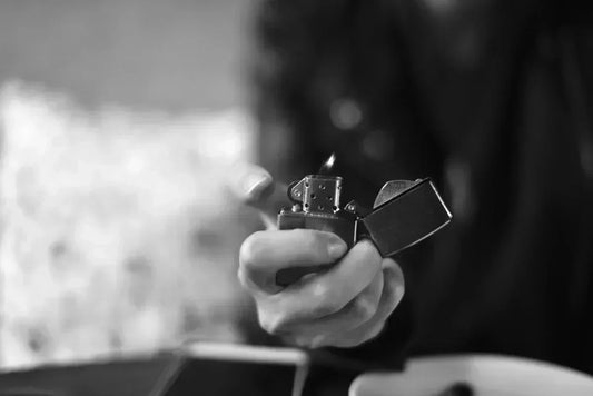 Person holding a fancy refillable cigarette lighter in hand |NTH