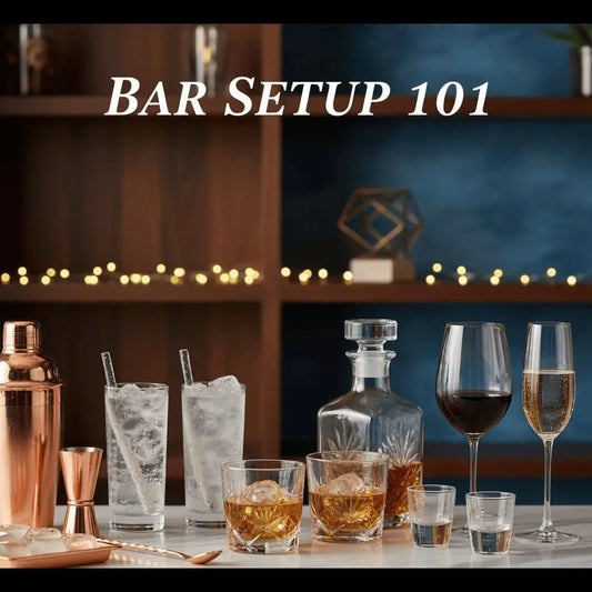 Essential bar glasses and copper tools displayed on a stylish home bar counter.
